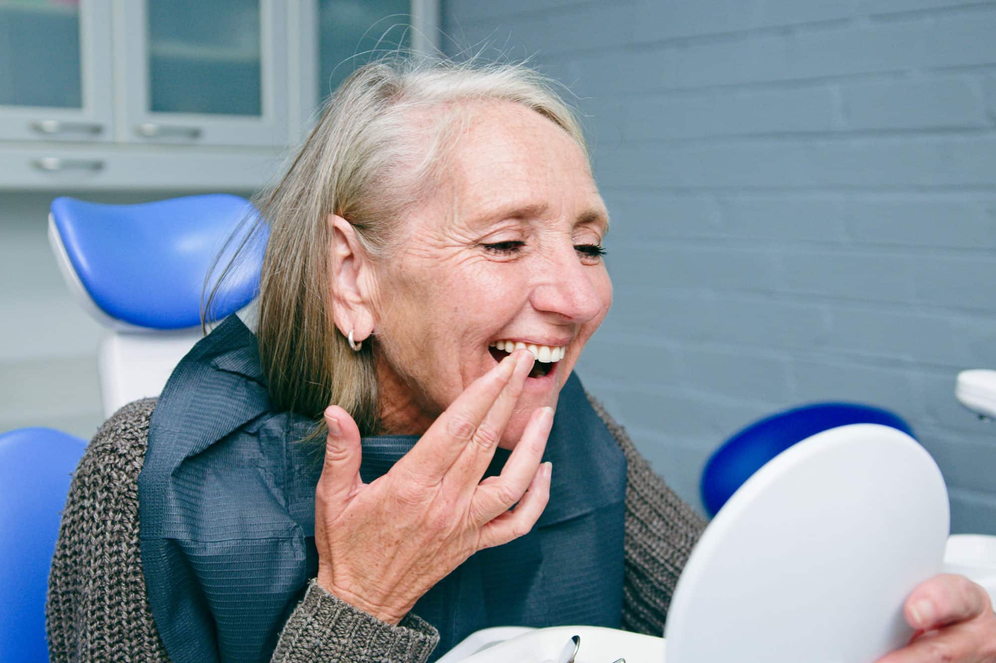 MFD Dentist Pointing at X-Ray Picture During Client Consultation