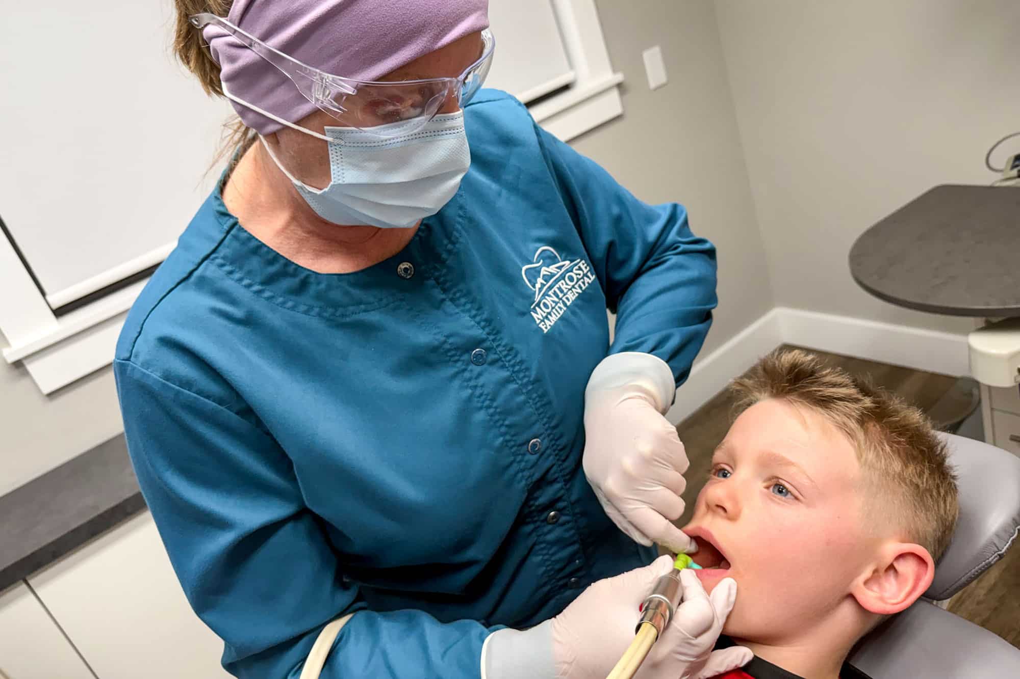 MFD Dentist Pointing at X-Ray Picture During Client Consultation